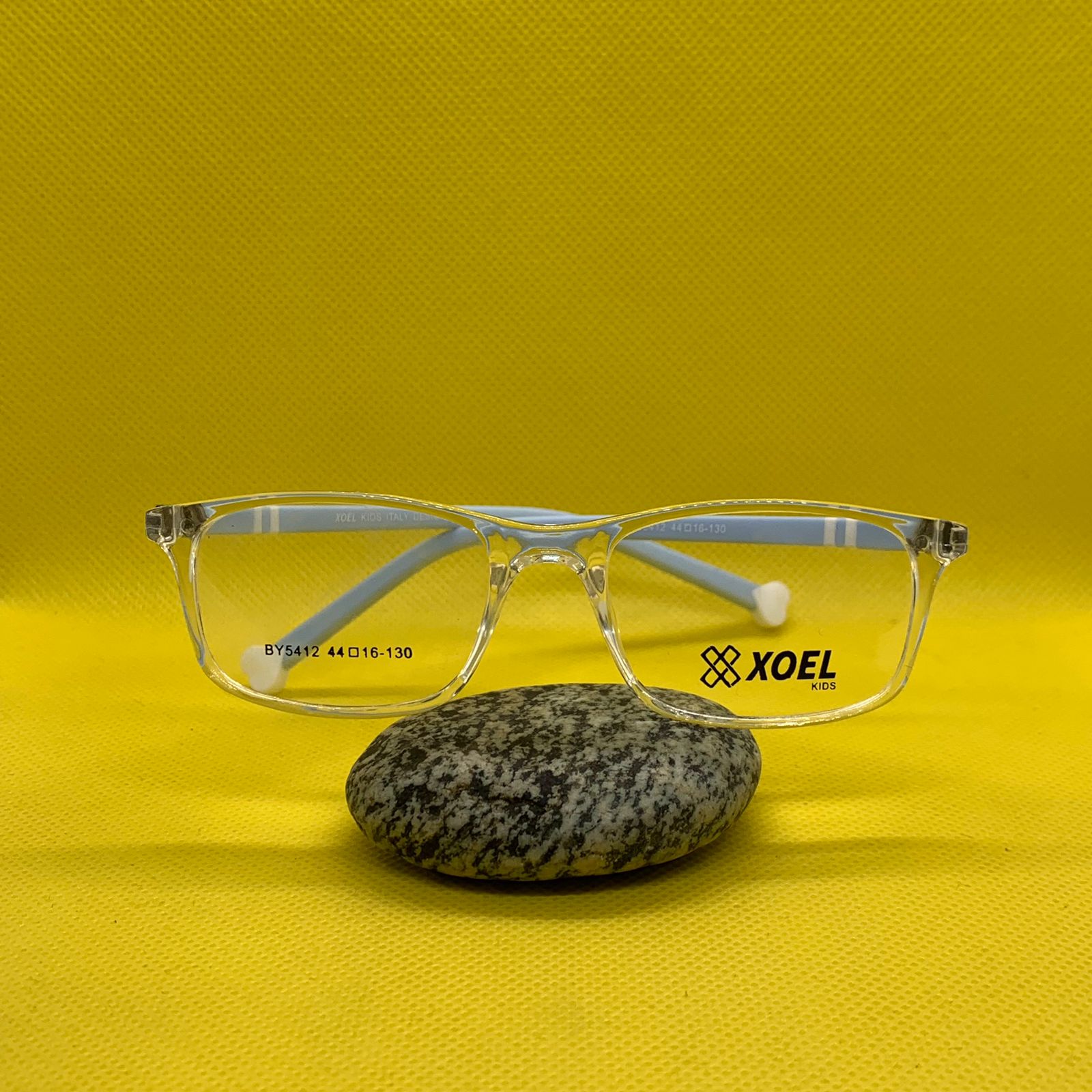 WhatsApp-Image-2025-09-25-at-12.11.45-PM.jpeg Kids’ Transparent Rectangle Eyeglass Frame with Blue Sticks – Lightweight & Durable Glasses - Image 1