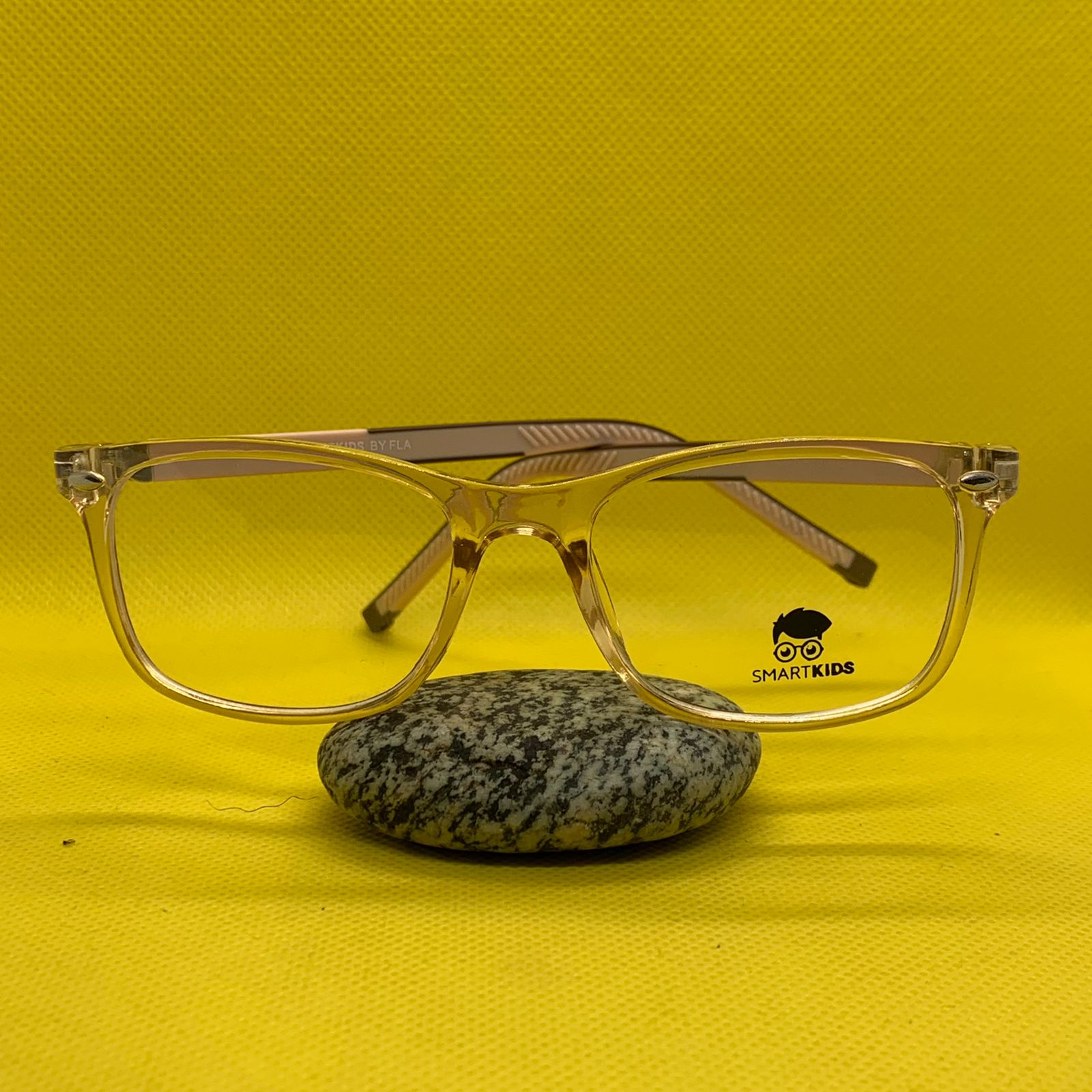 WhatsApp-Image-2025-09-25-at-12.12.03-PM.jpeg Kids’ Transparent Brown Square Eyeglass Frame with 360° Spring Hinges – Lightweight & Flexible - Image 1